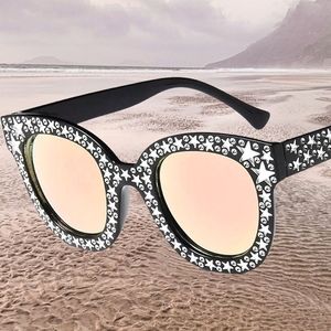 Fashion black with pink lenses sunglasses 👓 with star studded design.